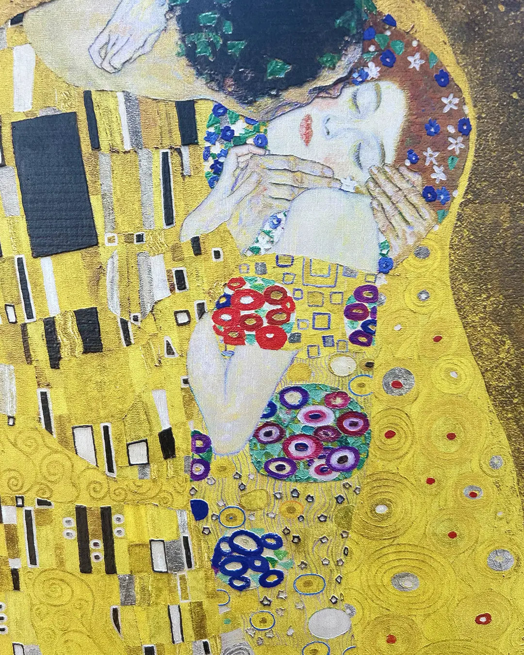 Artistic depiction of 'The Kiss' by Gustav Klimt with added decorative elements.
